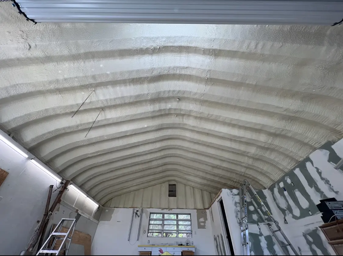 Spray polyurethane foam applied to the underside of a metal roof deck in Hillsborough